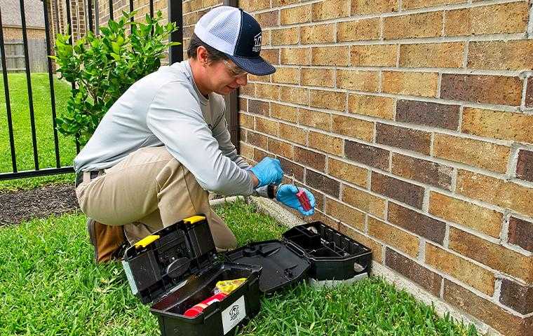 technician inspecting a home in cypress texas
