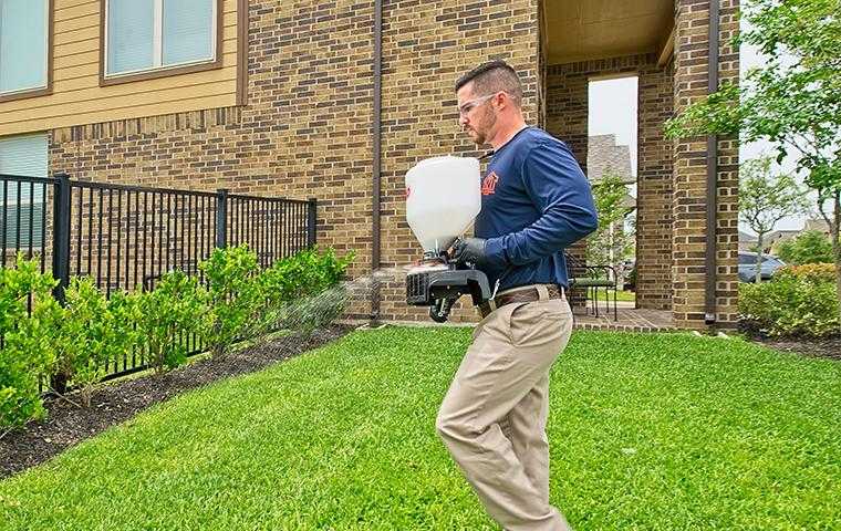 a technician treating a home in cypress texas